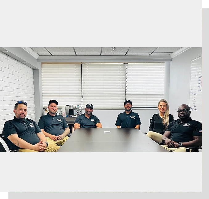 A group of people sitting at a table.