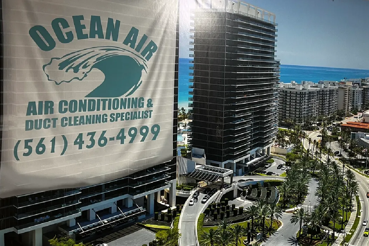 A large building with ocean air logo on it.