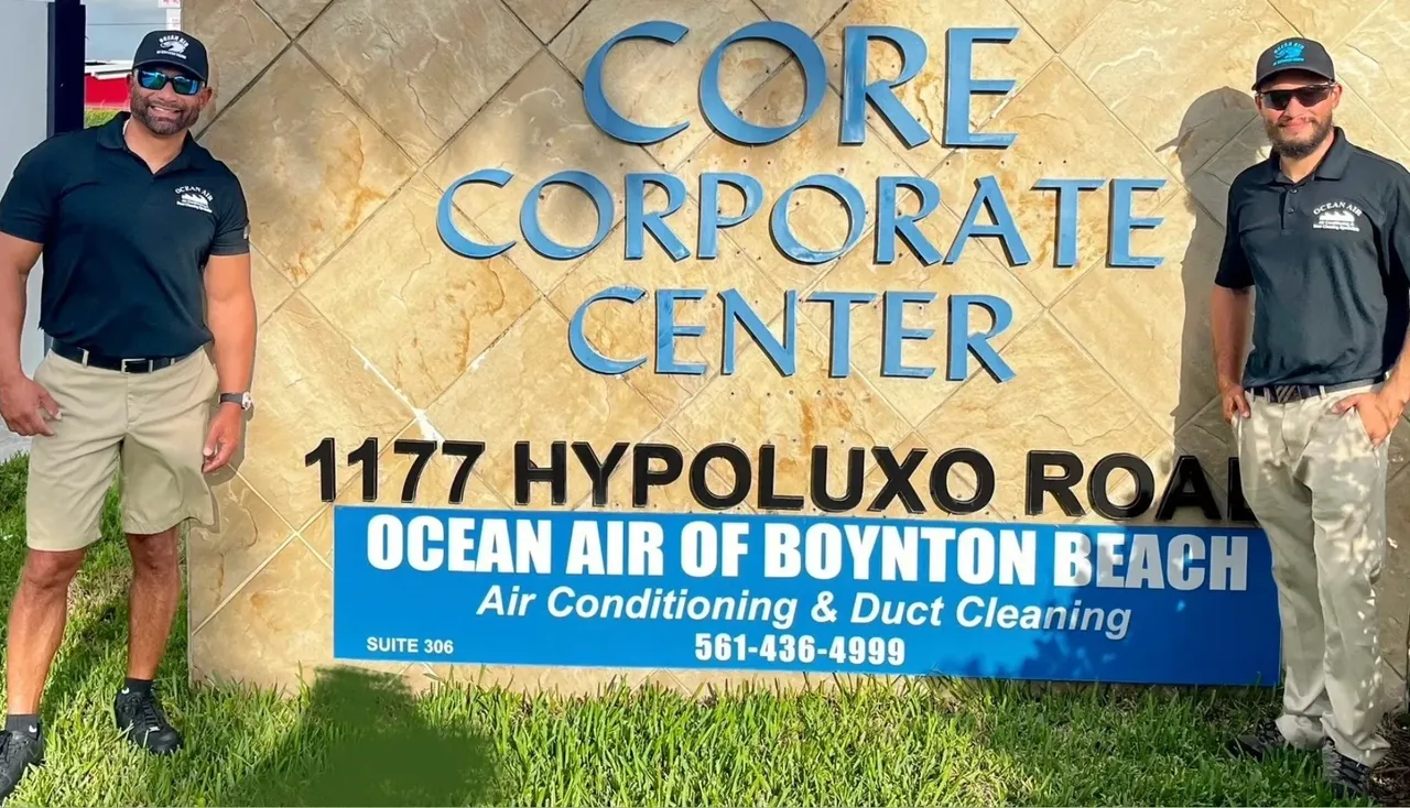 A sign for the core corporate center in front of a building.